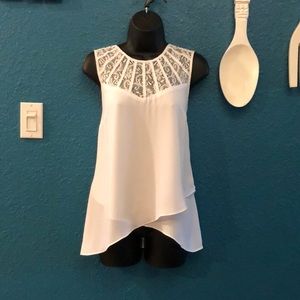 Sleeveless white top with lace